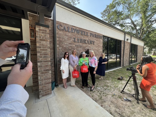 State Library and Caldwell Parish Library leaders cut the ribbon on the library's expansion.